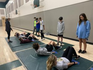 0 Period PE 1 students practice the curl-ups area of the Calif. standardized fitness testing. Usually the official test is conducted in May.