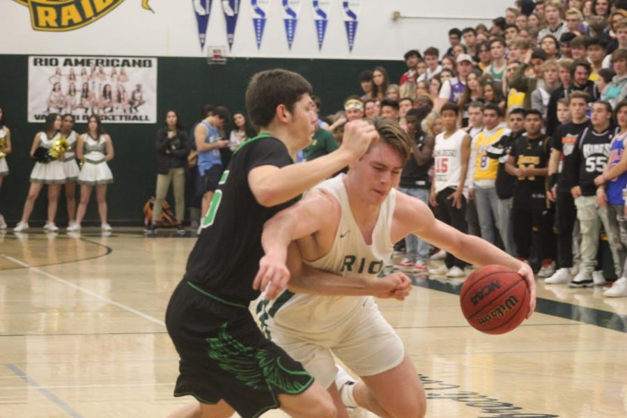 Mitchell Dixon protects the ball against an El Camino player 