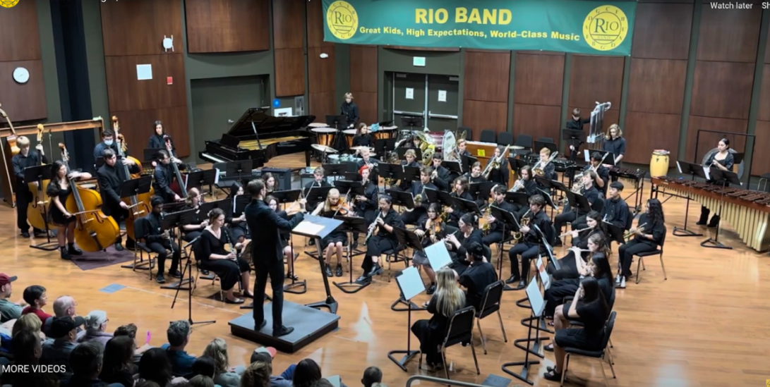 Assistant band director Mitch Evett leads the band.