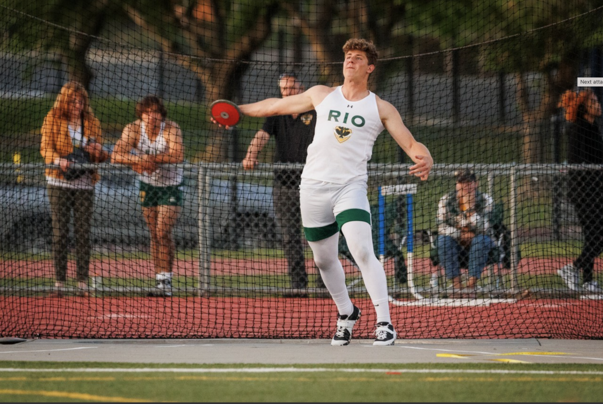 Rio Americano High School's Chase Dinaburg throws a discuss at a Capital Athletic League meet. Dinaburg leads the league.