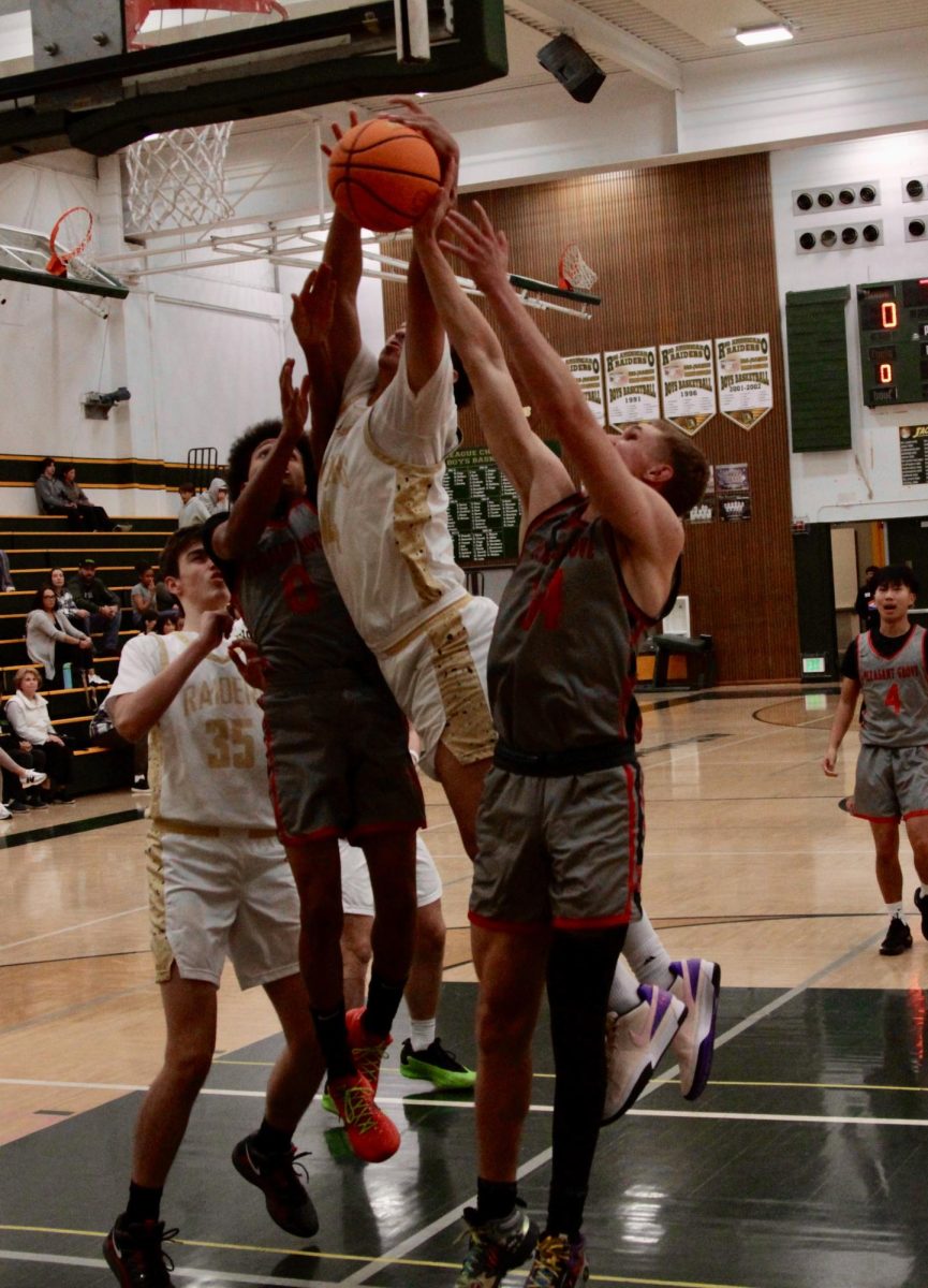 Max Harry grabs a rebound against Pleasant Grove in a preseason game in November, 2024.