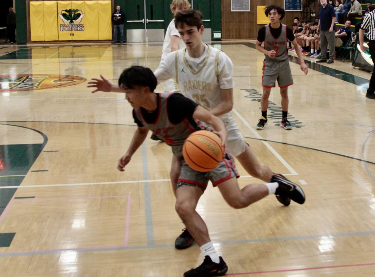 Jared Mikacich (11) guards against Pleasant Grove in a preseason game in November, 2024.