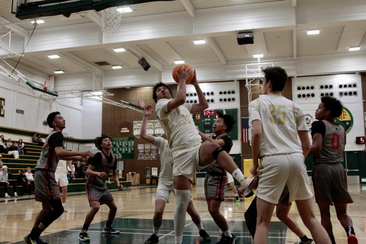 Max Harry (12) collects a rebound against Pleasant Grove in a preseason game in November 2024.