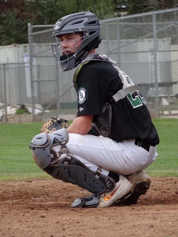 Senior Nolan Barry plays catcher for the Varsity boys baseball team, and hopes to compete in college.