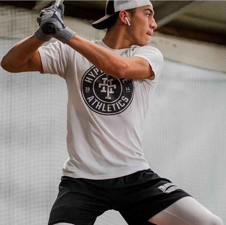 Senior Elijah Rogalski practices his swing at Hyperthrive Athletics, a gym near Sacramento State.