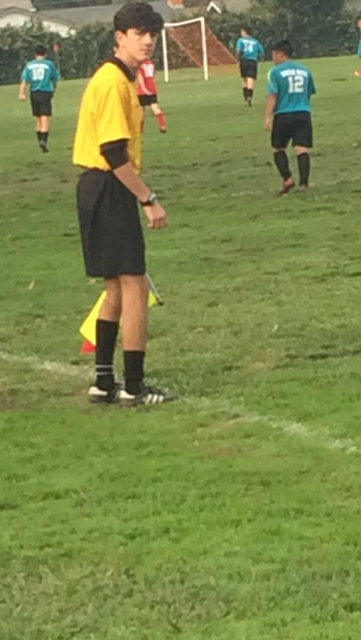 Junior Pasquale De Luca refereeing boys soccer on Nov. 18.