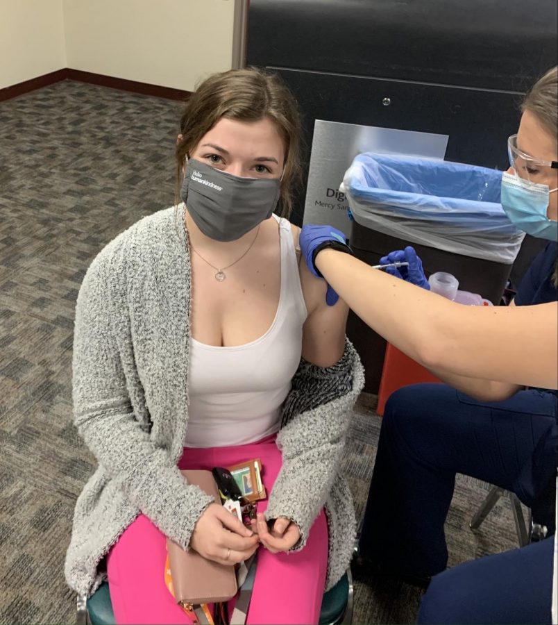 Senior Emma Hutchinson receives her first dose of the Pfizer COVID-19 vaccine.