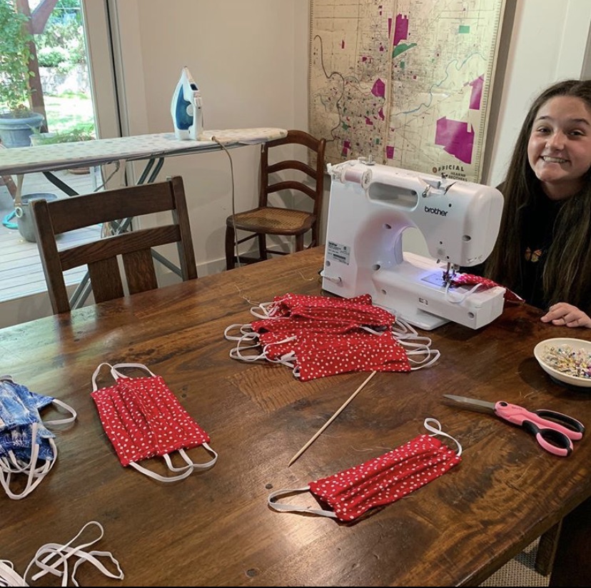 Davis works on sewing masks at her home to promote safety during the COVID-19 pandemic. 