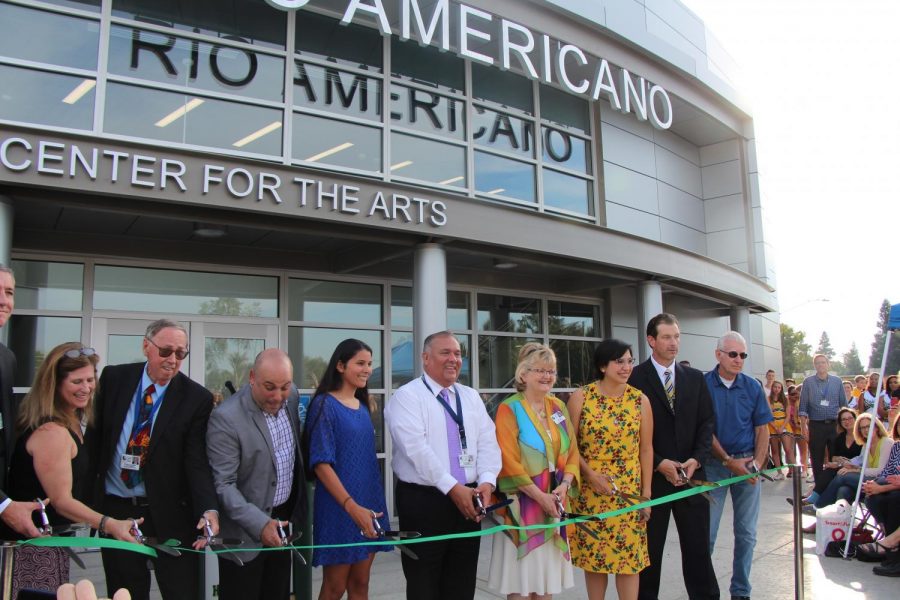 Music Director Josh Murray (third from left), former principal Brian Ginter (second from right) and district officials cut the ribbon to officially open the new theater in 2017, which was funded by the last San Juan bond measure.