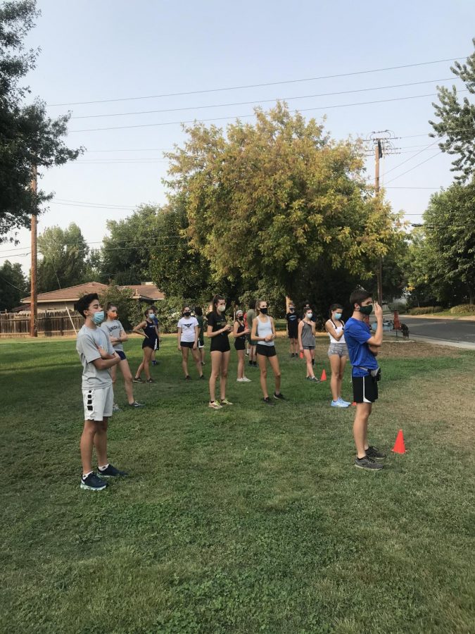 The cross country team lines up in socially distant pods for conditioning through their coach's club Sacramento Valley Endurance.