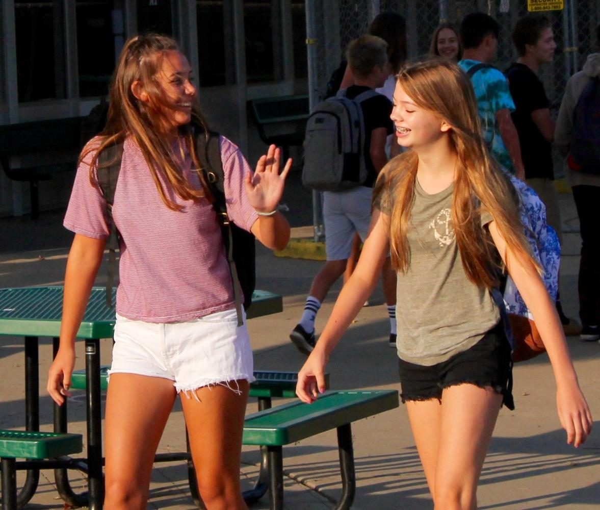 Students arrive to school at the new 7:55 start time on the first day.