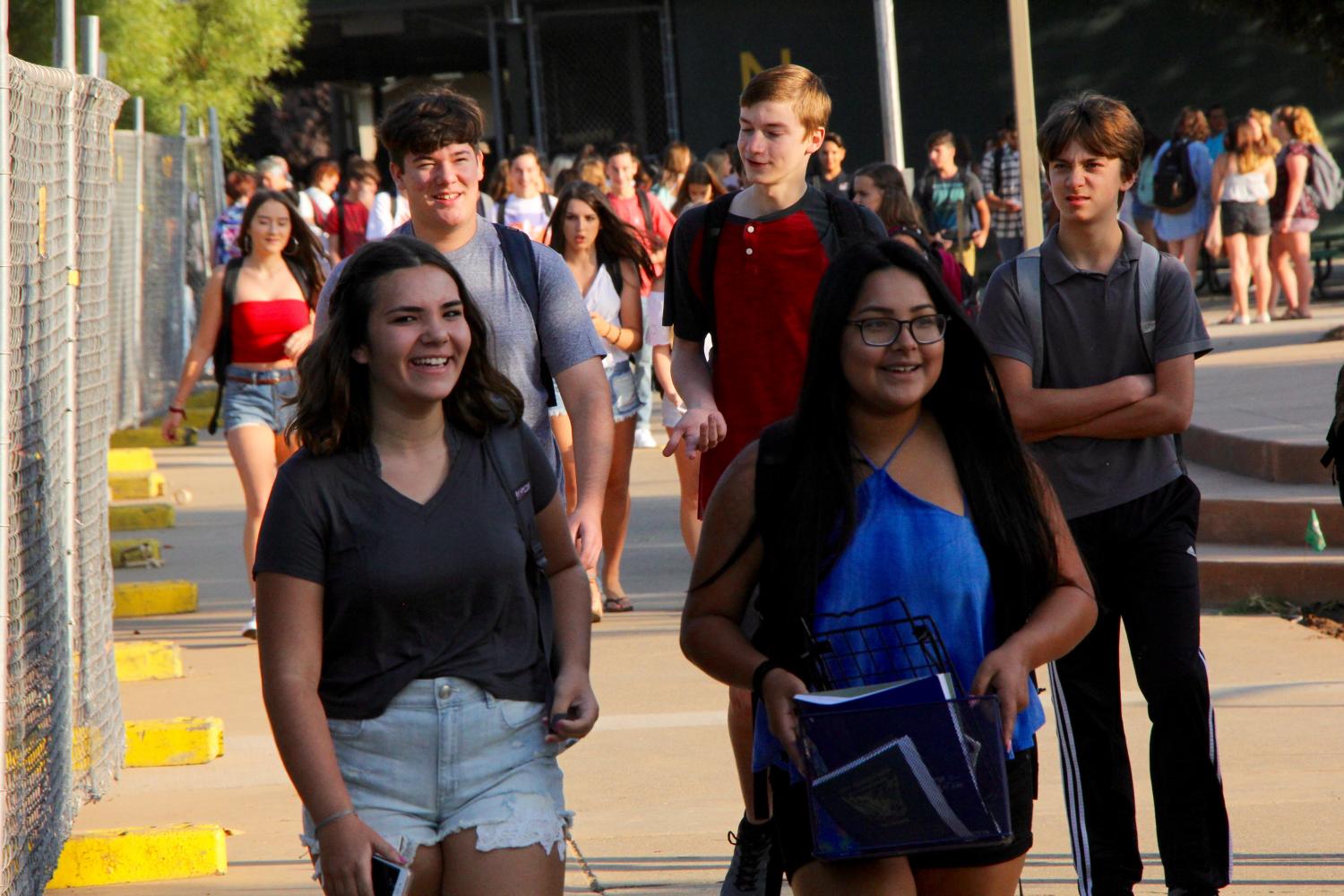 Students arrive to school on the first day.