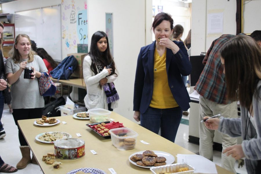 Math teacher Jamie Bonato samples a cookie during the judging period.