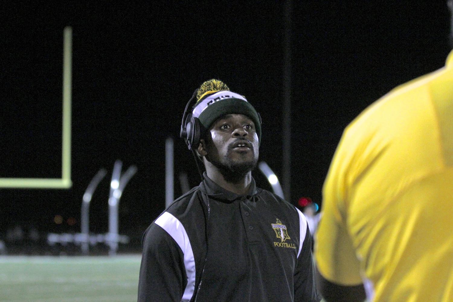 Football coach Sammie Stroughter directs players during Friday’s 42-35 win against Cordova.