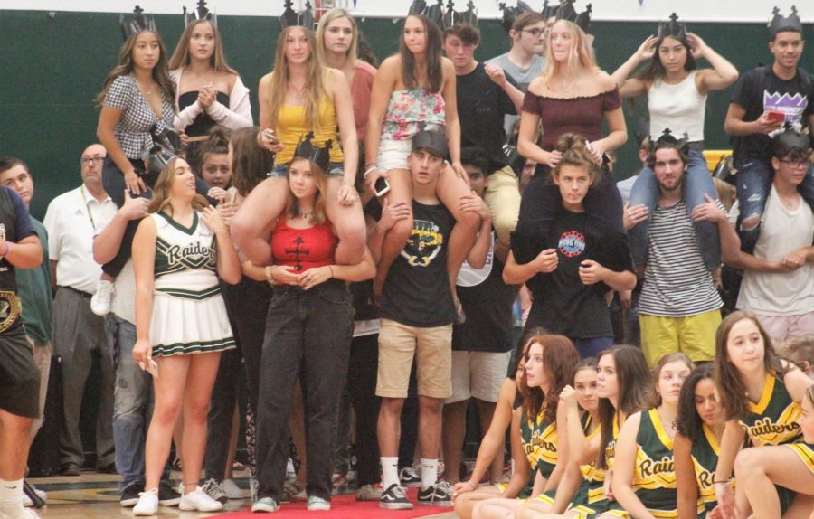 Seniors eargerly await finally walking down the ceremonial red carpet into their last back-to-school rally.