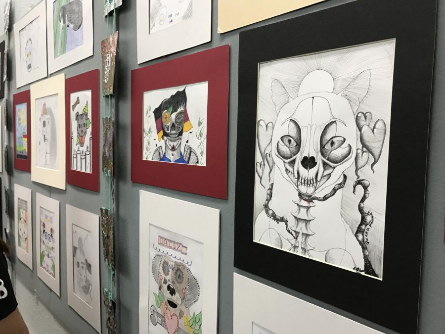 The Dia de los Muertos art show allows students to create works that re ect the Mexican holiday. Personal meaning is also woven into each piece, as the holiday honors those who have passed on.