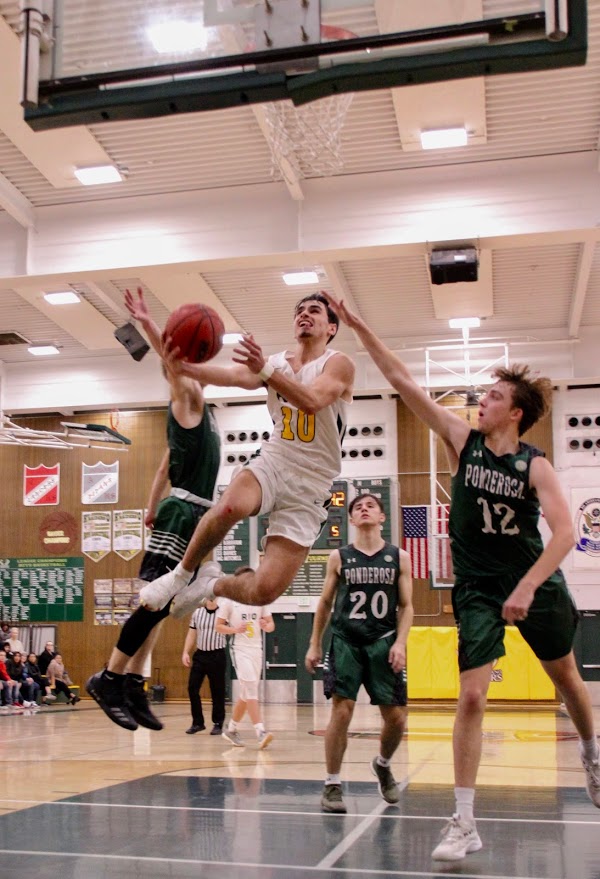 Senior Jake Paxton makes an improbable layup after blowing past three defenders.