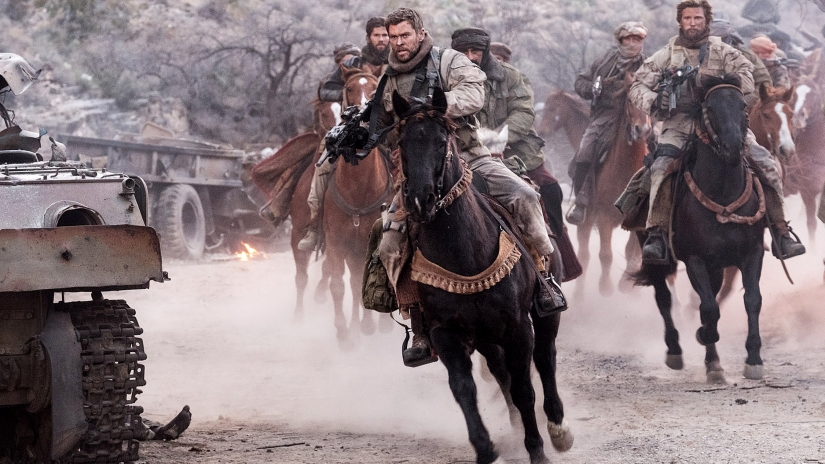 Mitch Nelson (Chris Hemsworth) rides into battle in '12 Strong.'