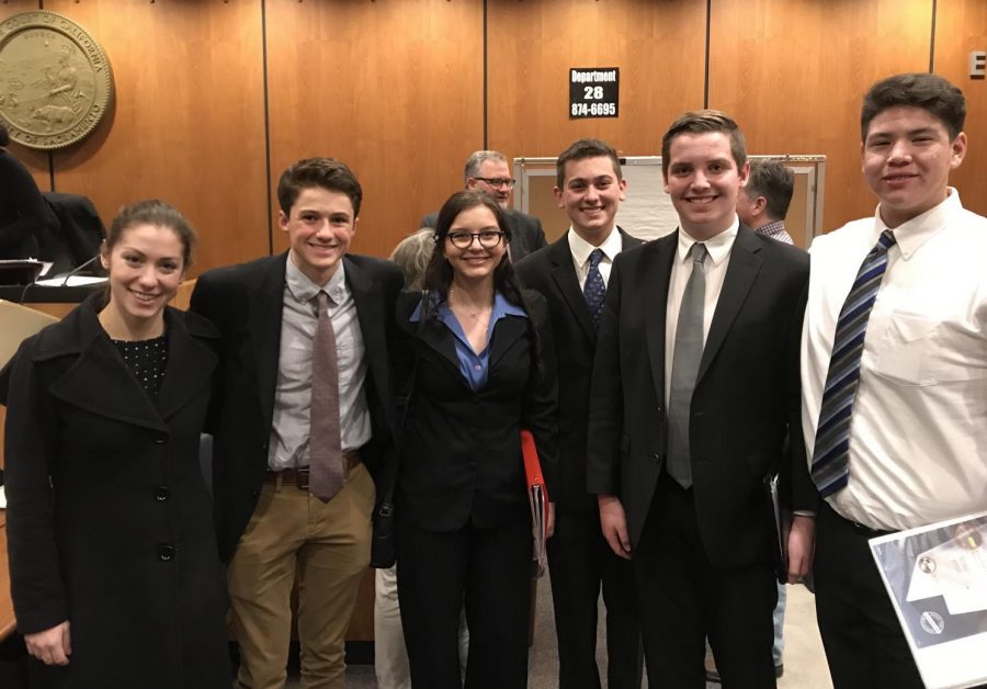 Moot Court team members Hudson Burke, Emma Phoenix, Kabir Tagore, Ben Davis, and Alec Sumner with coach after competition. 