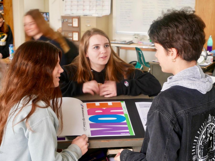 Yearbook editors Liz Gore, Riley Stoddard and Justine Waters proof the cover for this year's Tesoro.